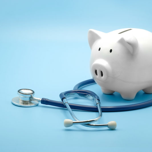 Piggy,Bank,With,Stethoscope,Isolated,On,Light,Blue,Background,With